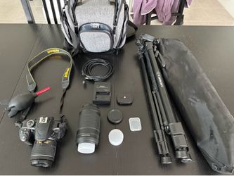 Nikon D3400 DSLR Camera Kit with lenses, case, and tripod