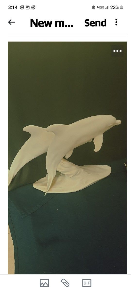 aiser porcelain 2 Dolphin sculpture, specifically a bisque (unglazed matte finish) porcelain piece featuring two dolphins. 