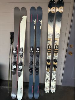 SKIS- 3 pairs of  twin tip skis including boots and poles if