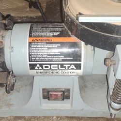 Delta 23-710 sharpening center with wide 4" vertical grinding wheel and horizontal wet stone.