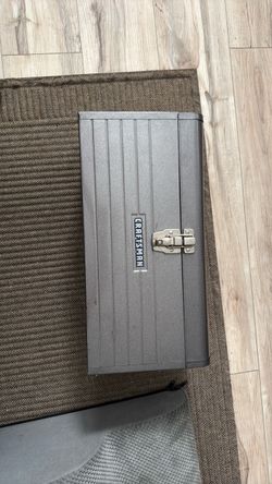 Craftsman metal toolbox is gray with a red removable interior tray.
