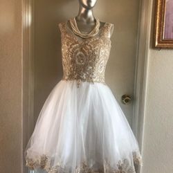 Woman’s Gold And White Dress