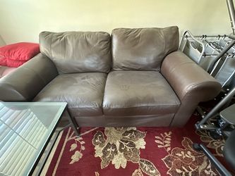 2 Brown Leather Love Seats and 1 Leather Ottoman
