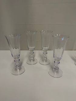 Four Clear Ribbed Glass Champagne Flutes with Decorative Stems