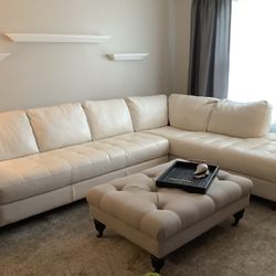 Off White Leather Sofa And Beige Ottoman.