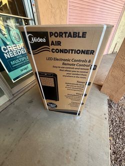 Portable air-conditioning unit 13,500 BTU cools 450 ft.² comes with window Kit