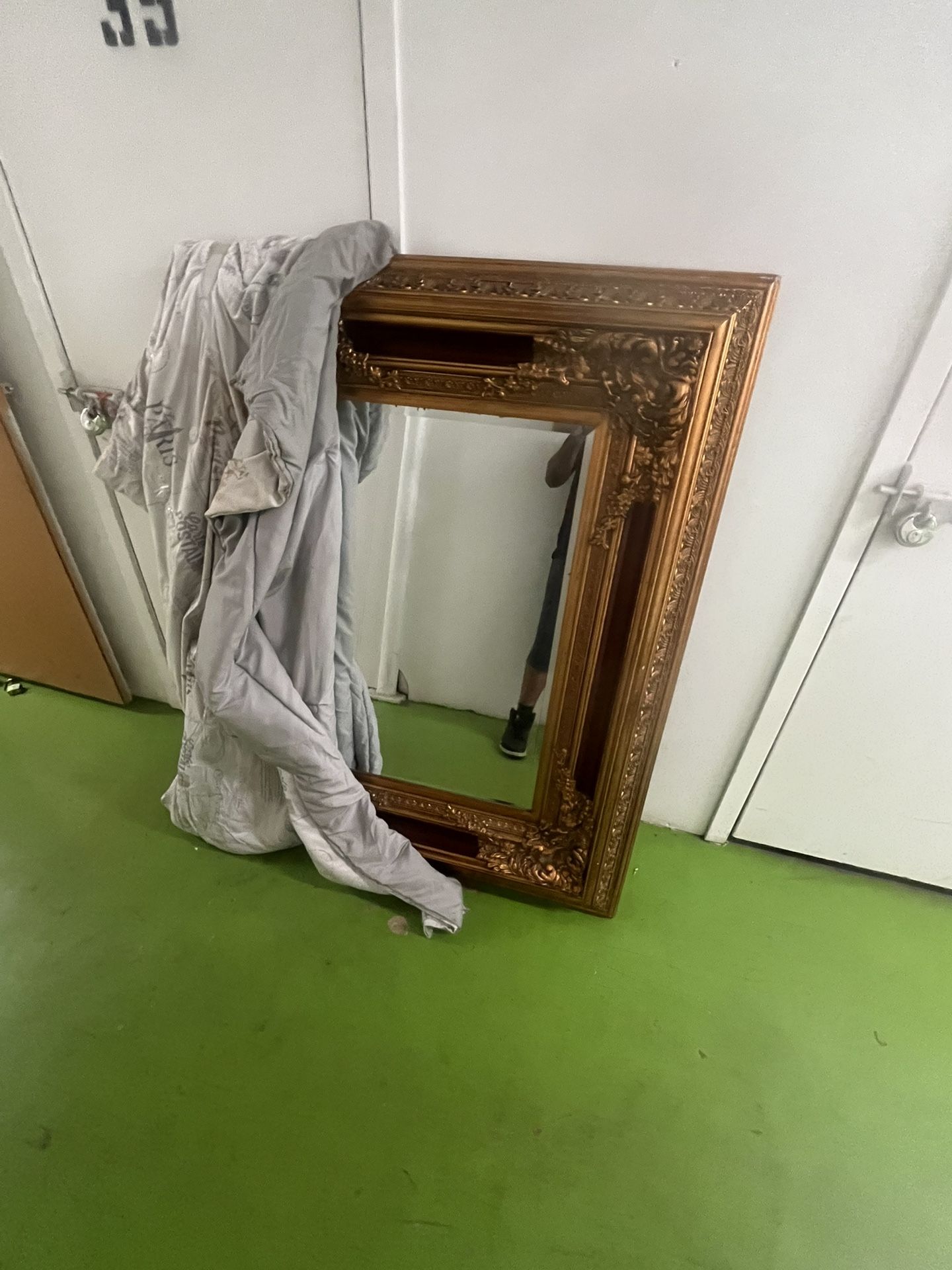 Large ornate gold and red mirror