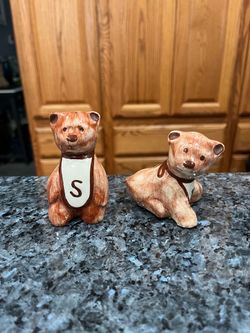 Vintage ceramic Cute Bears Pair of Salt and Pepper Shakers no stoppers.  The tallest is Approximately 3 1/4 inches tall .  There is a sticker that say
