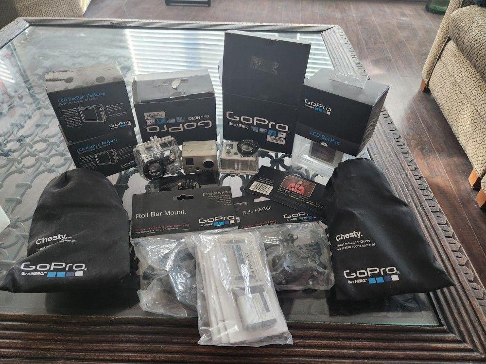 2 Older GoPros With Accessories