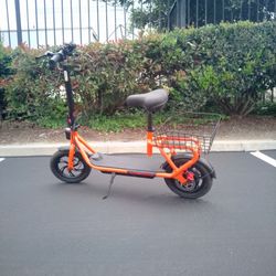 Orange electric seated scooter