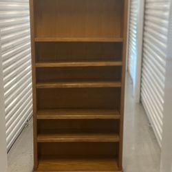 Grand oak 6 ft solid wood adjustable bookcase in great condition.  31705 Wesley Chapel blvd Fl 33543 Storage Mart  