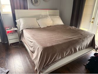 King bed without mattress and night stand