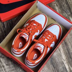 White and orange sports shoes