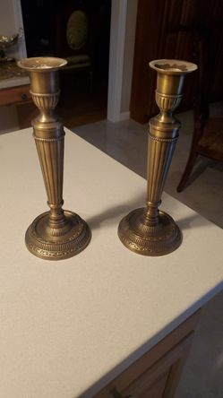 Gold metal candle holder .