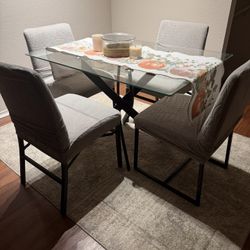 Glass table and four chairs