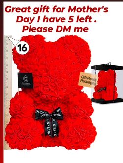 Beautiful red rose bear, 16 inches tall. This Roseraie bear is made from artificial roses. Has a cute black ribbon around its neck with 'mon amour' te