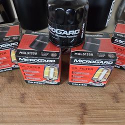Microgard oil filters (4), plus a comparable Purolator oil filter.