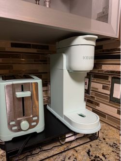 Keurig Coffe maker light blue with matching toaster