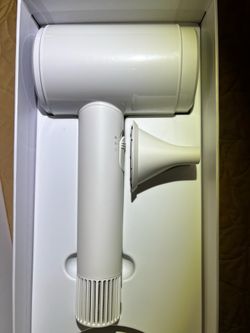 Lylux cordless hair dryer featuring an upgraded version with a 110,000 RPM brushless motor and low-heat hair care technology