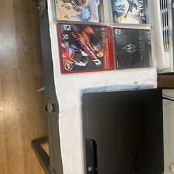 PlayStation 3 with games and one controller