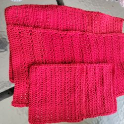 Hand crocheted red dish towels (2) and dish cloths (2).
