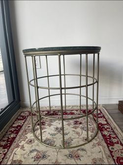 $150, two modern art corner tables