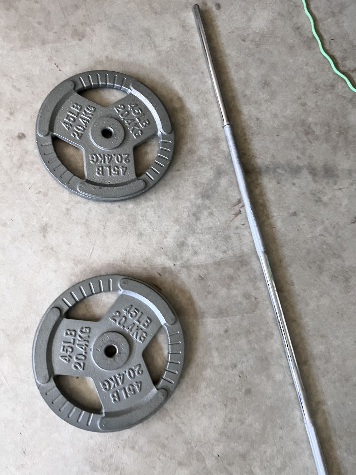 84 inch Barbell and and two 1 inch 45 pound plates