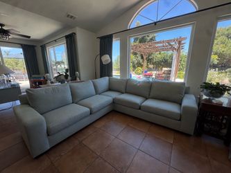 Pottery Barn light blue couch