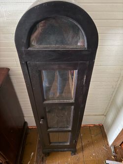 Vintage black arched curio cabinet