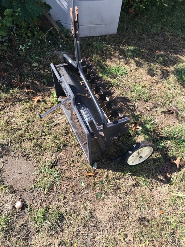 Spreader for lawn mower or tractor