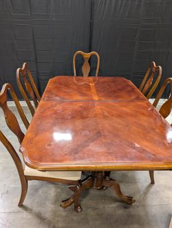 Traditional Dark Wood Dining Table with Six Shaped-Back Chairs