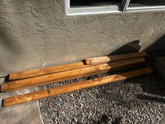 stacked rectangular softwood lumber boards