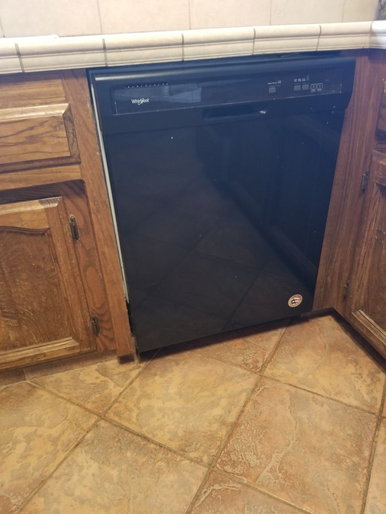 Whirlpool dishwasher and GE electric cooktop.