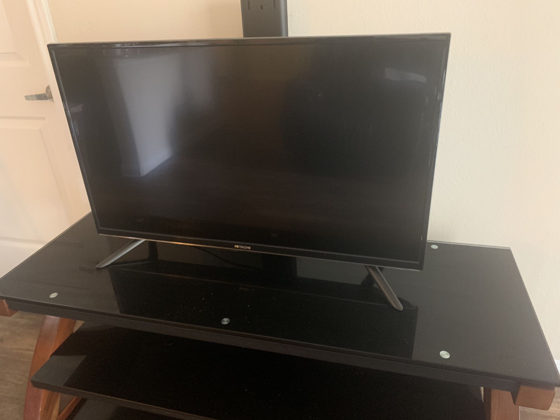 Hitachi 40” Roku TV with tv stand