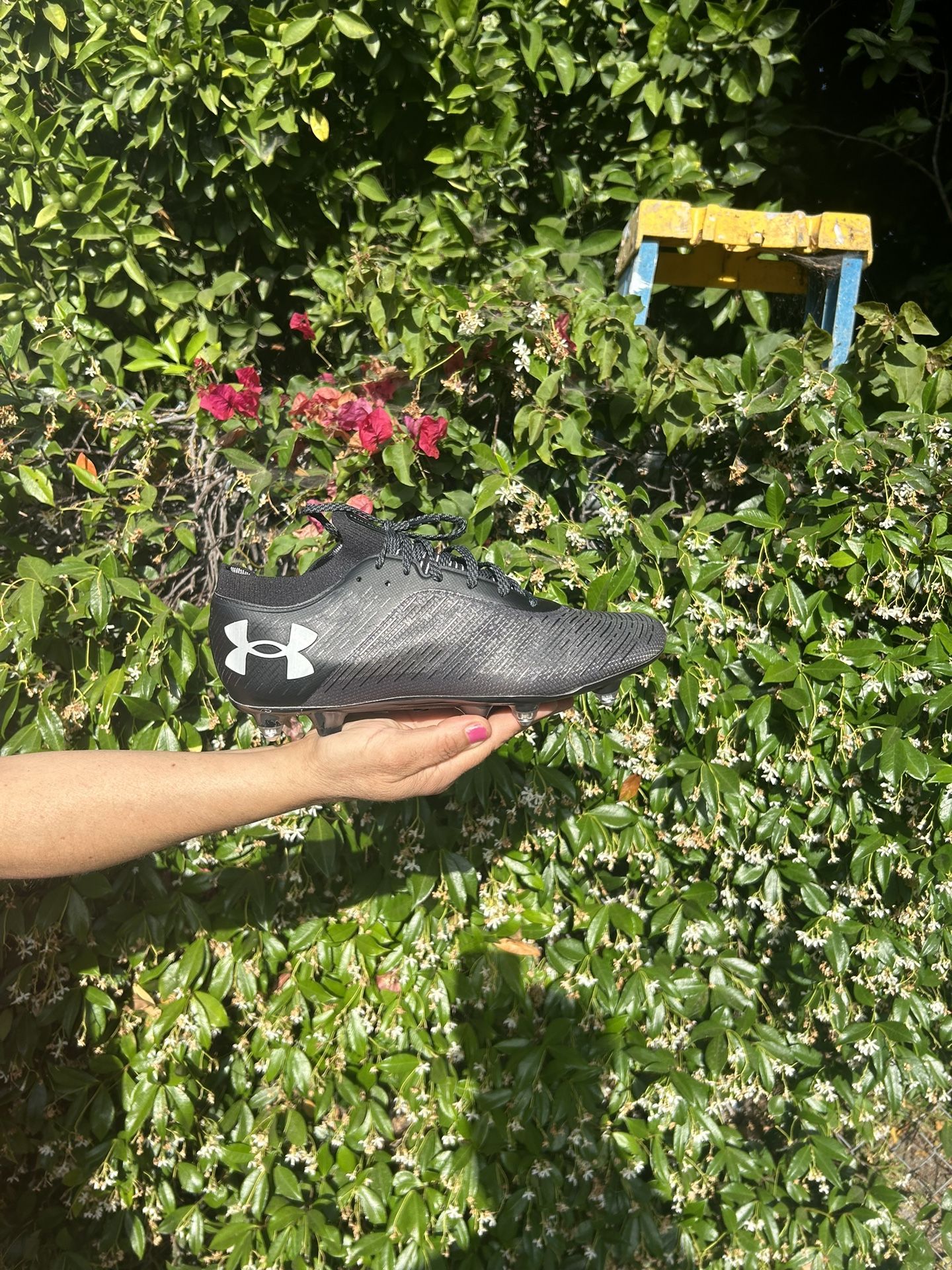 Black metal studs under armour soccer cleats