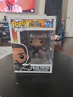 The Funko Pop! Marvel: Black Panther Unmasked (#273) vinyl bobblehead.