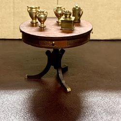 Beautiful finish on this table. 3 3/4" in diameter and miniature accessories 