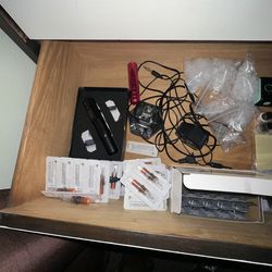Bundle of tattoo guns and supplies