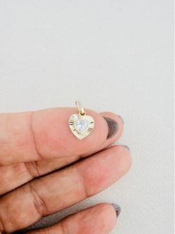 ✨ 10K Yellow Gold Pendant ✨ A dainty heart pendant in 10K yellow gold, accented with sparkling white cubic zirconia. ❤️ 10K yellow gold ❤️ Tiny hear