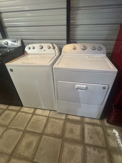 Top load washer and electric dryer
