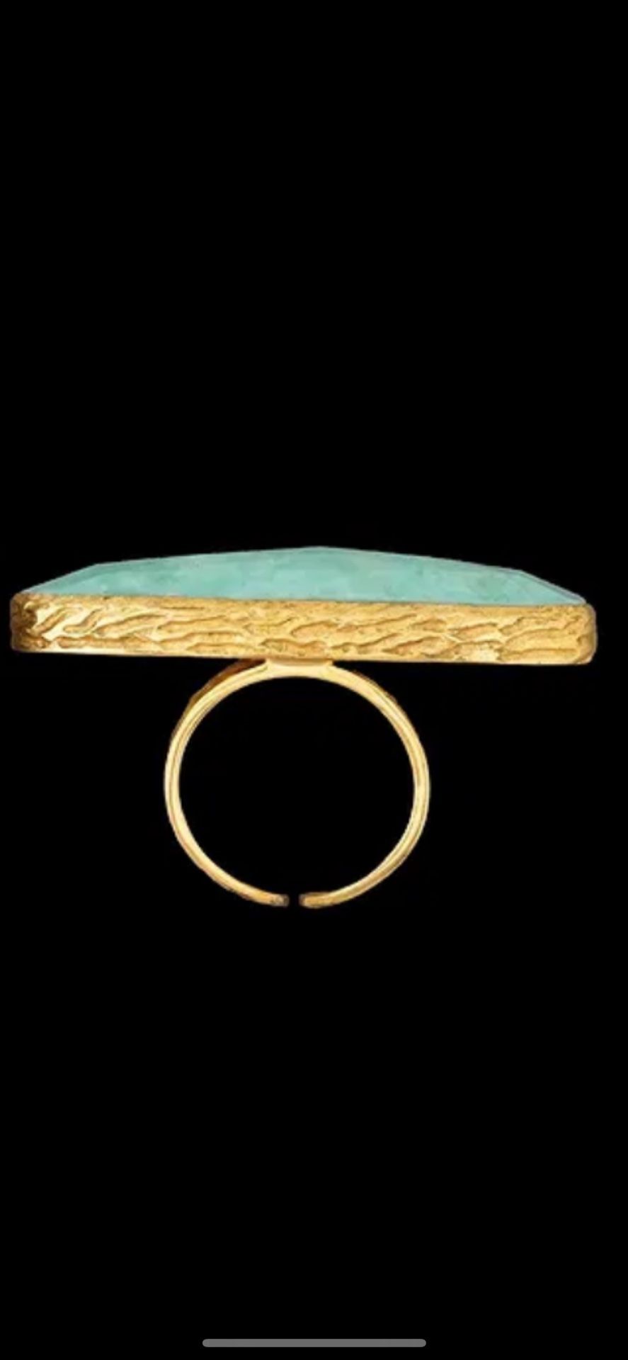 Ring w/large, long, oval carved green color stone