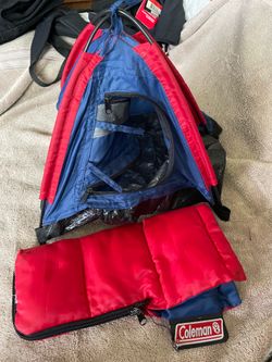 Coleman mini tent commonly used as a children's toy or display model.The tent features a zipper door and includes a matching sleeping bag as part of a