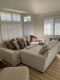 Living spaces beige/light grey couch, loveseat and ottoman!