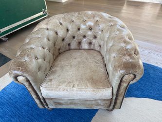 Pair Distressed leather tufted Chesterfield club chairs