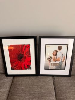 Two 16x20” wood picture frames with glass cover