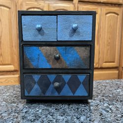 Harry Potter Ravenclaw house trinket box with 4 drawers.  Size 7 1/2 inches tall.  Preowned.  Smoke free home 