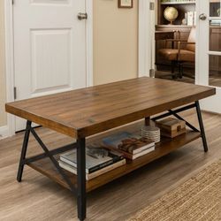 Wooden coffee table 48"L24"D 18"H
Wooden table and metal frame 