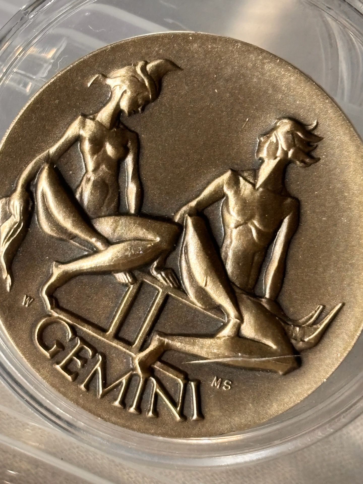 Sterling Gemini zodiac medal featuring the twins design by sculptor Paul Manship.