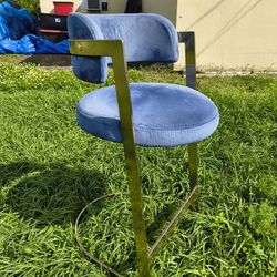 Meridian Furniture Stephanie velvet counter stool, featuring blue velvet upholstery and a gold-finished metal base. 