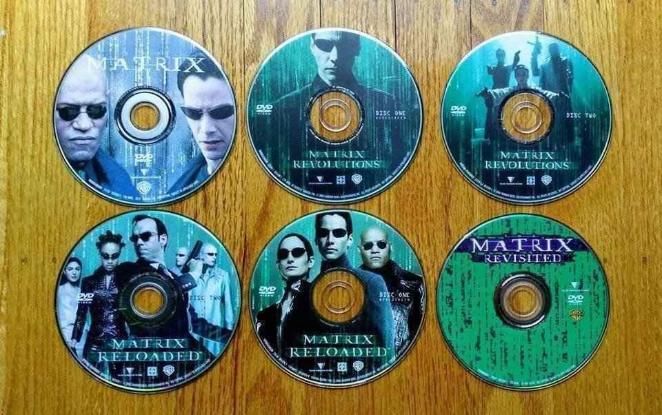 The Matrix, Matrix Reloaded, Matrix Revolutions, Matrix Revisited DVDs